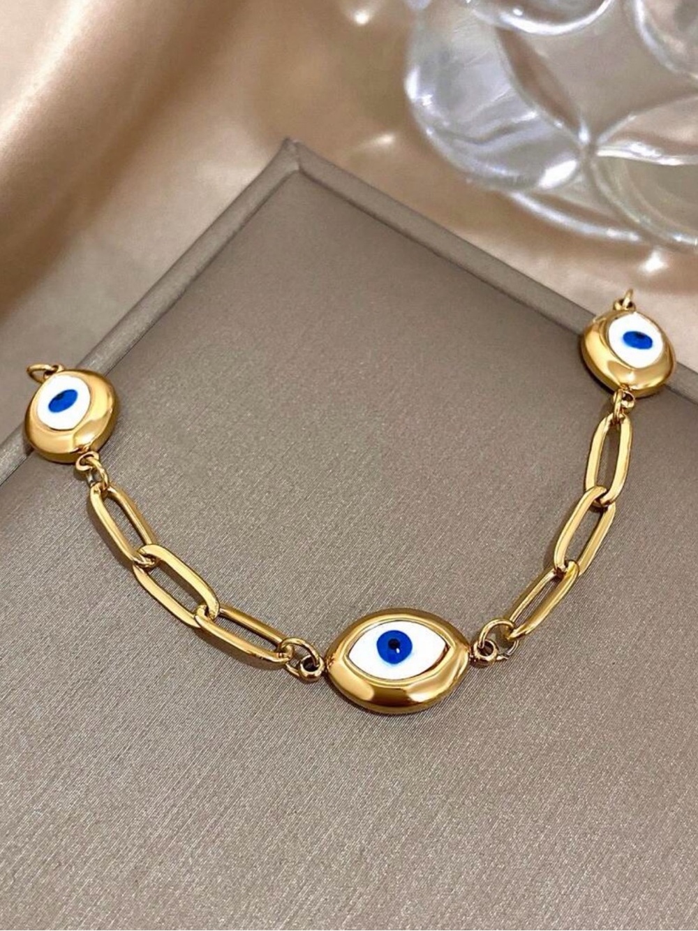Gold-Tone Bracelet with Blue & White Eye Charms
